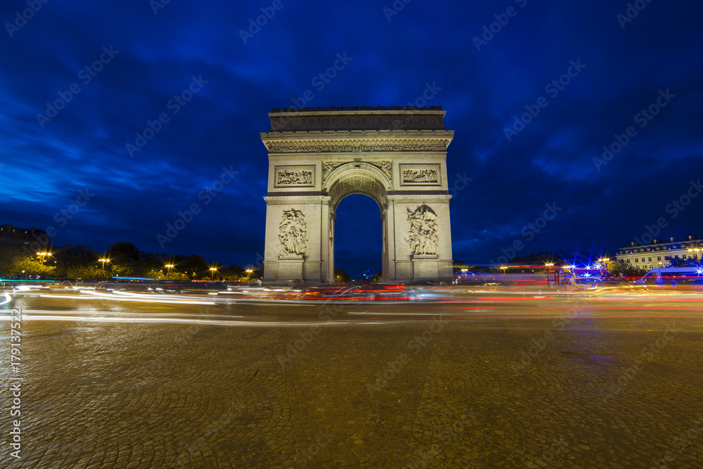 View of arc de triomphe during the twilight and long exposure image with light trails