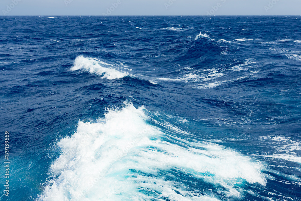 Clouds, waves and ship trace in Pacific