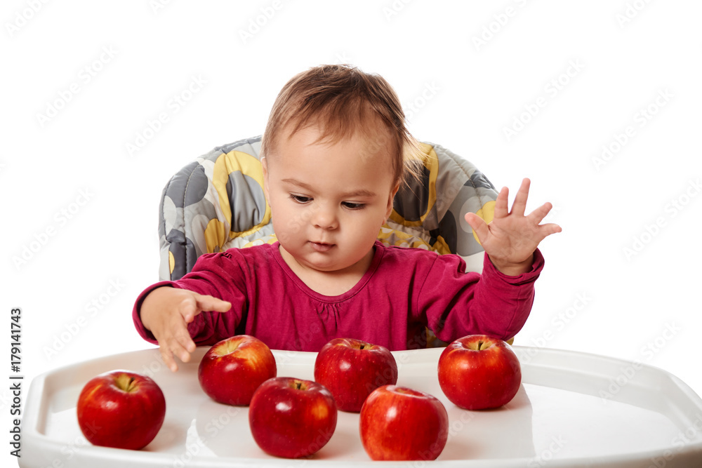 Cute child with red apples isolated on white background Cute child with red apples isolated on white background