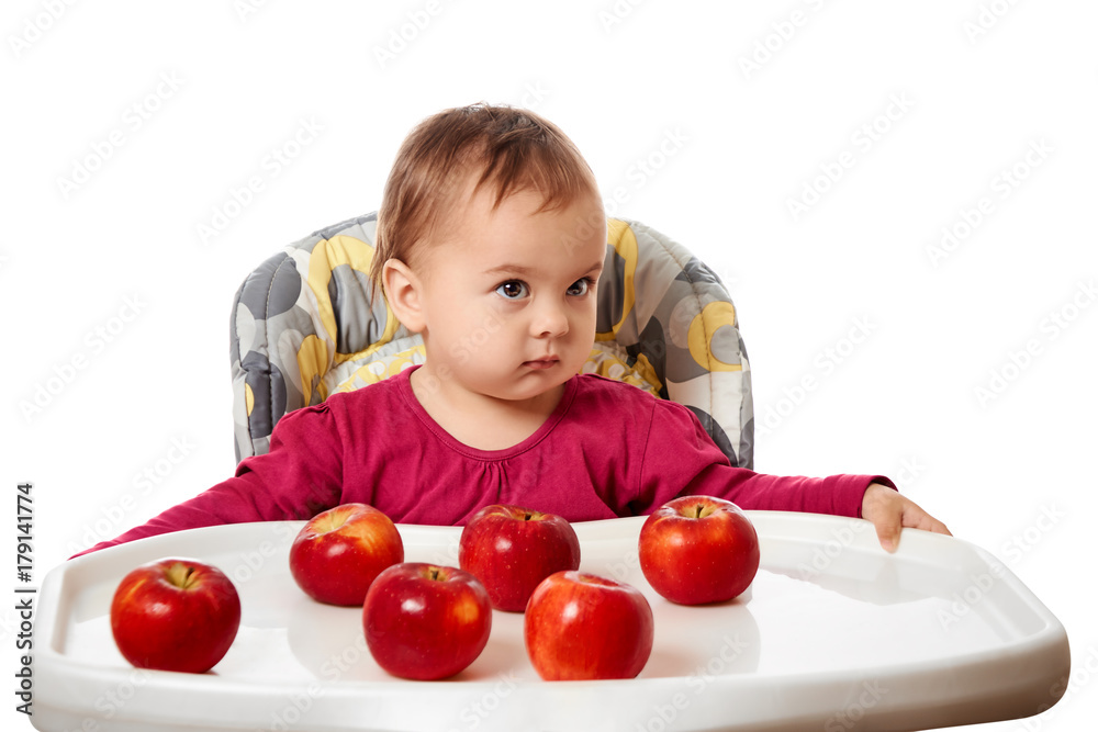 Cute child with red apples isolated on white background Cute child with red apples isolated on white background