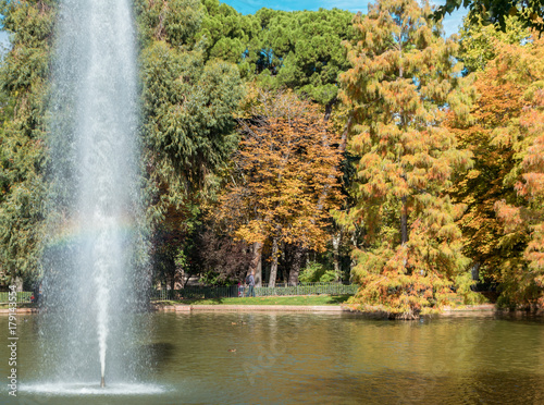 paisaje otoñal con arco iris en parque retiro Madrid photo