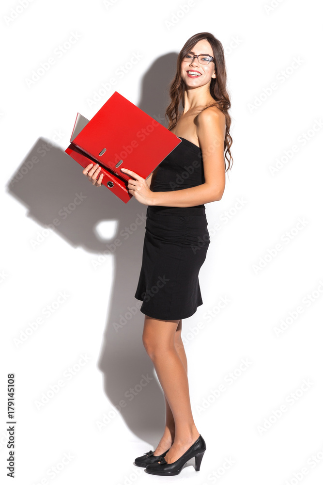 sexy girl in business black dress and sunglasses on a white background holding a plate and smiling, selective focus on the tablet sexy girl in business black dress and sunglasses on a white background holding a plate and smiling, selective focus on the tablet