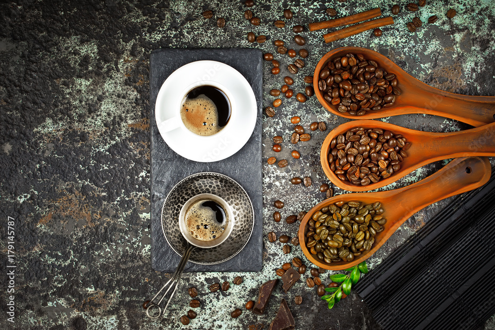 Black coffee in a cup on the background of coffee beans in a composition with accessories Black coffee in a cup on the background of coffee beans in a composition with accessories