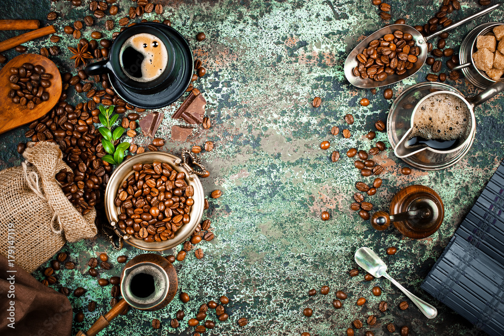 Black coffee in a cup on the background of coffee beans in a composition with accessories Black coffee in a cup on the background of coffee beans in a composition with accessories