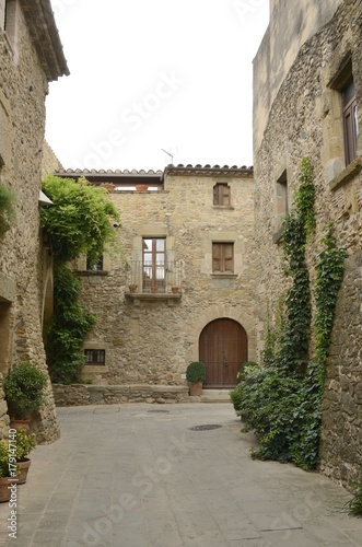 Fototapeta Naklejka Na Ścianę i Meble -  Cobblestone street in in Monells, Girona, Spain