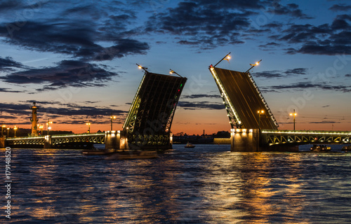 Palace Bridge (1912-1916), a road- and foot-traffic bascule bridge, spans the Neva River between Palace Square and Vasilievsky Island. White nights in Saint Petersburg, Russia