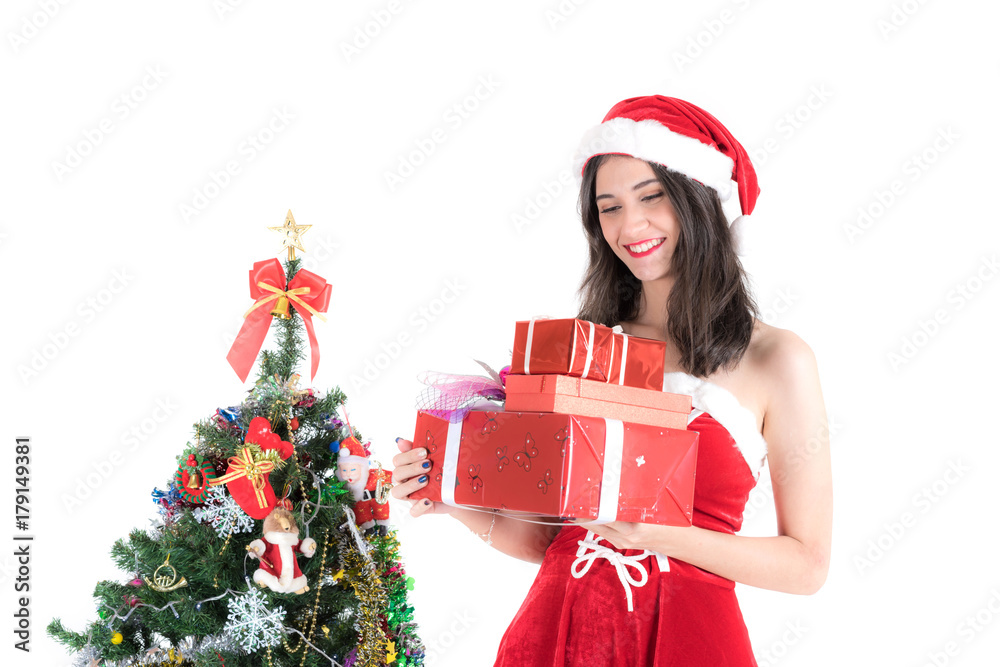 beautiful santa girl wearing santa claus clothes costume holding  Christmas gift Box and christmas tree over white background , happy new year - Christmas concept 
