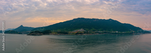 Approaches to Kwangyang, Soutn Korea from sea. Early morning. Red sunrise