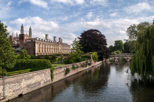 Cam River embankment with university building (Cambridge, England)