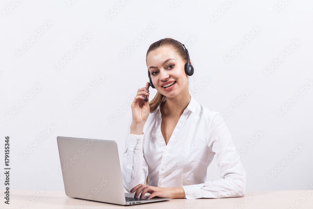Picture of beautiful business lady working on PC and talking with customer Picture of beautiful business lady working on PC and talking with customer
