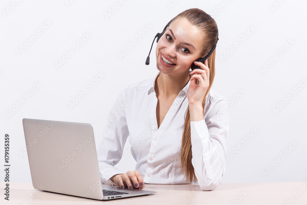 Picture of beautiful business lady working on PC and talking with customer Picture of beautiful business lady working on PC and talking with customer