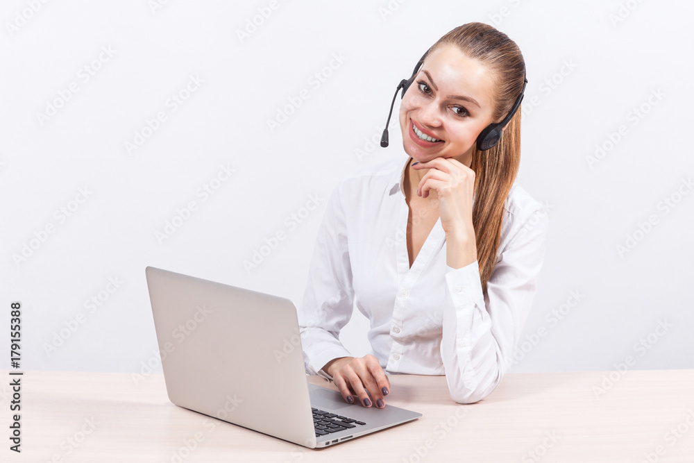 Picture of beautiful business lady working on PC and talking with customer Picture of beautiful business lady working on PC and talking with customer