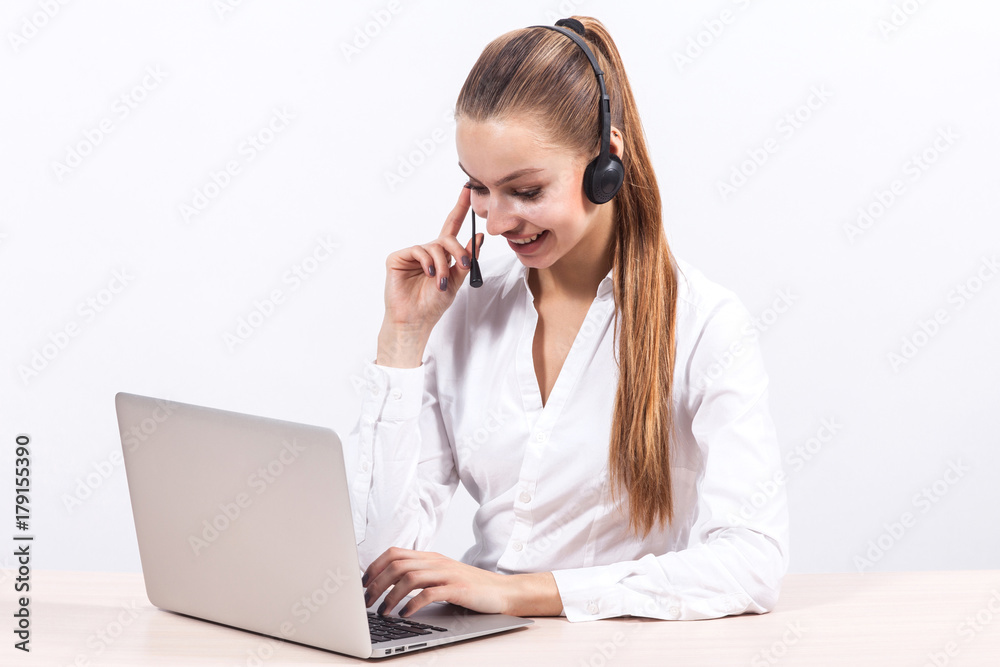 Picture of beautiful business lady working on PC and talking with customer Picture of beautiful business lady working on PC and talking with customer
