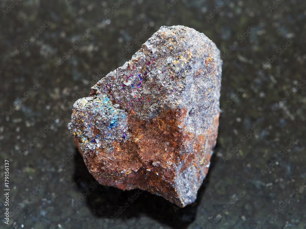 Fototapeta premium raw magnetite (iron ore) stone on dark background