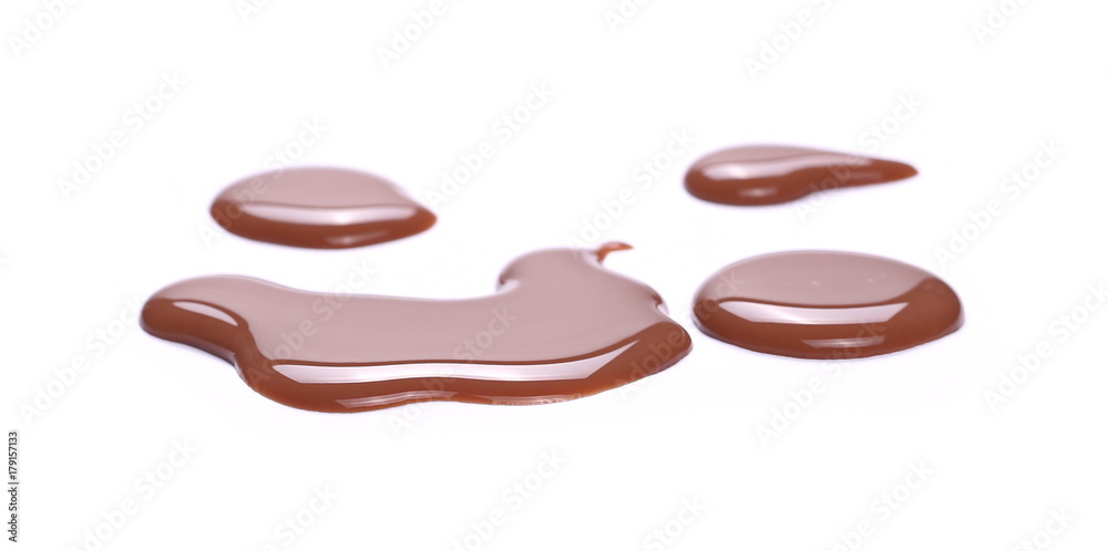 Fototapeta premium Spilled chocolate milk puddle isolated on white background