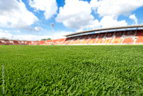 football field ball on green grass , soccer field background texture