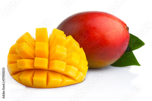 Ripe mango fruits with slices isolated on white