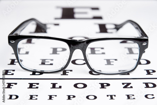 Glasses lie on the table for eye examination