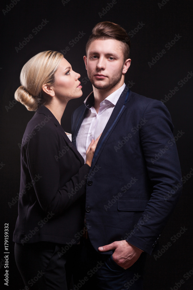 Picture of attractive couple of office workers standing Picture of attractive couple of office workers standing