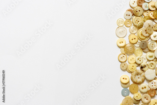 Clothes vintage buttons on white background with copyspace