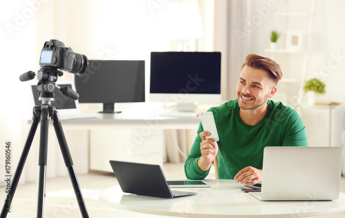 Young blogger recording vid...