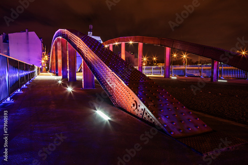 Poznan by night, the bridge over Cybina river between the cathedral island and the Srodka city disttrict. photo