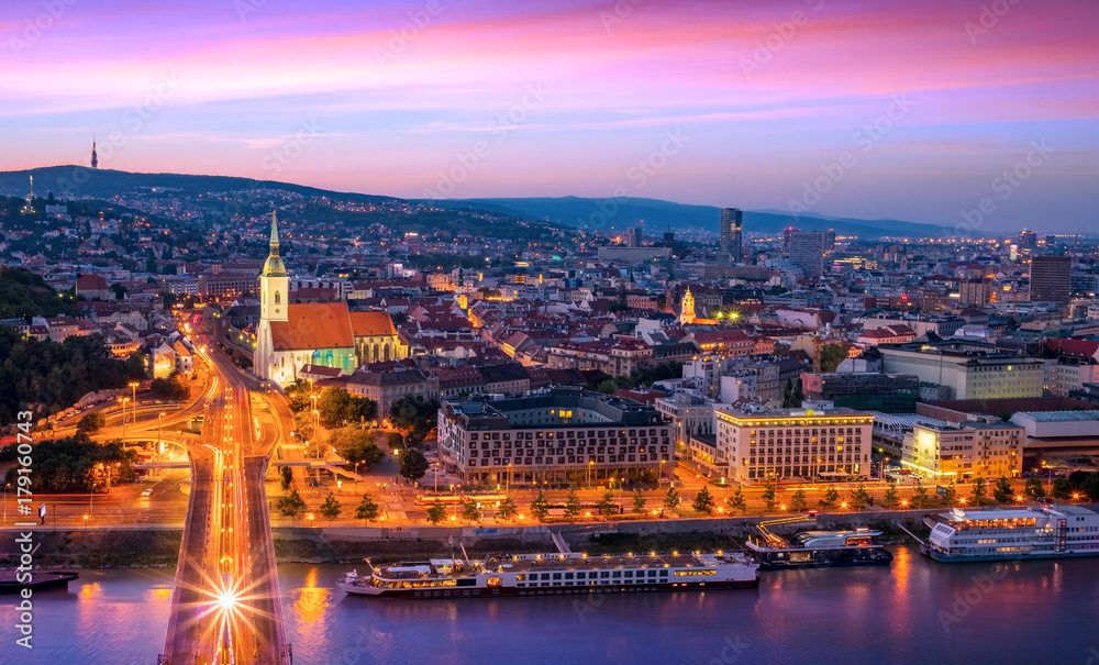 Aerial view of the Old Town in Bratislava, new bridge over Danube river with evening lights in capital city of Slovakia,Bratislava