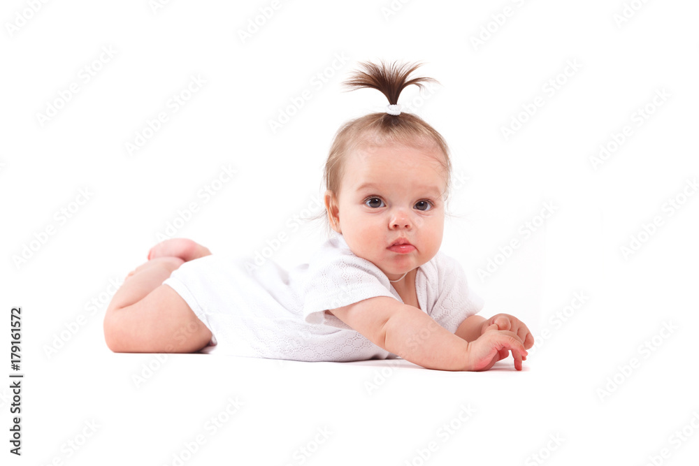 cute beautiful baby girl in white shirt lies on tummy with milk bottle cute beautiful baby girl in white shirt lies on tummy with milk bottle