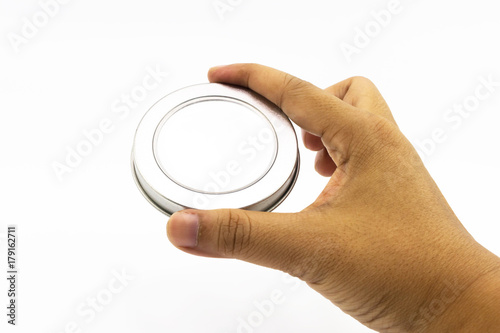 Hand's man holding transparent of metalic round lid