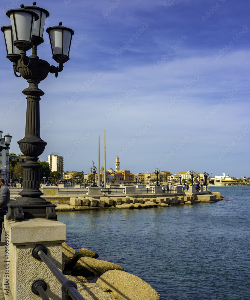 panoramic views of the waterfront of Bari, Puglia - Italy.In the foreground the characteristic lamppost
