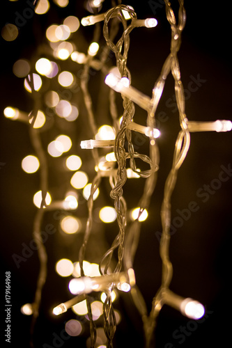 Christmas garland on black background. Silver style.Party decoration. Selective focus.