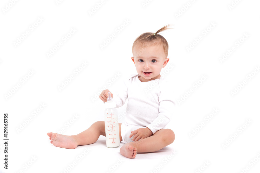 cute beautiful baby girl in white shirt sit and hold milk bottle cute beautiful baby girl in white shirt sit and hold milk bottle