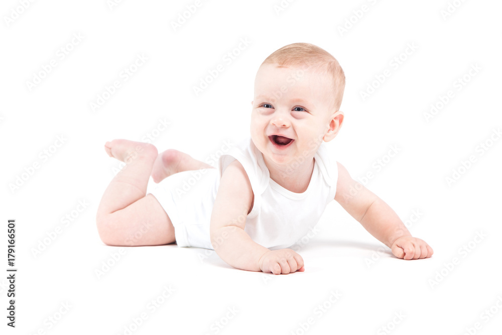 cute attractive baby boy in white shirt lies on tummy cute attractive baby boy in white shirt lies on tummy
