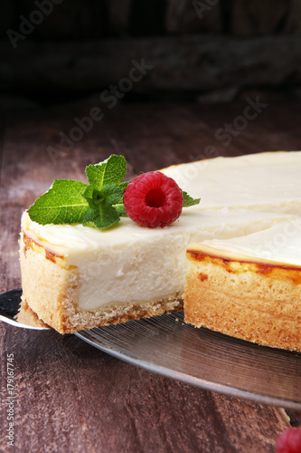 Homemade cheesecake with fresh berries and mint for dessert - healthy organic summer dessert pie cheesecake. Cheese cake