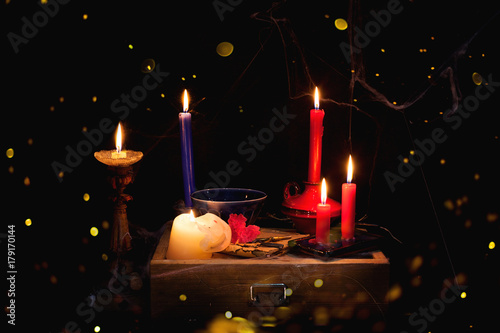 night and candle - divination of wax - polish tradition  - divination from  wax - evening predictions on the eve of St. Andrew photo