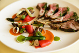 Racks of lamb on plate, isolated over black background