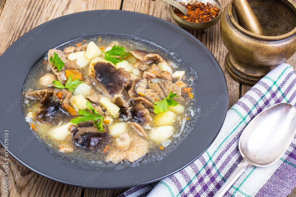 Black plate with wild mushroom soup