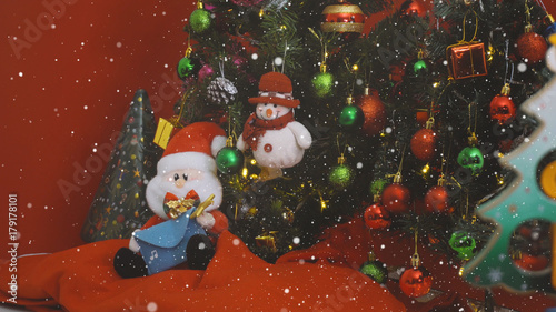 Greeting Season concept. Santa Claus and Snow man with ornaments on a Christmas tree with decorative light
