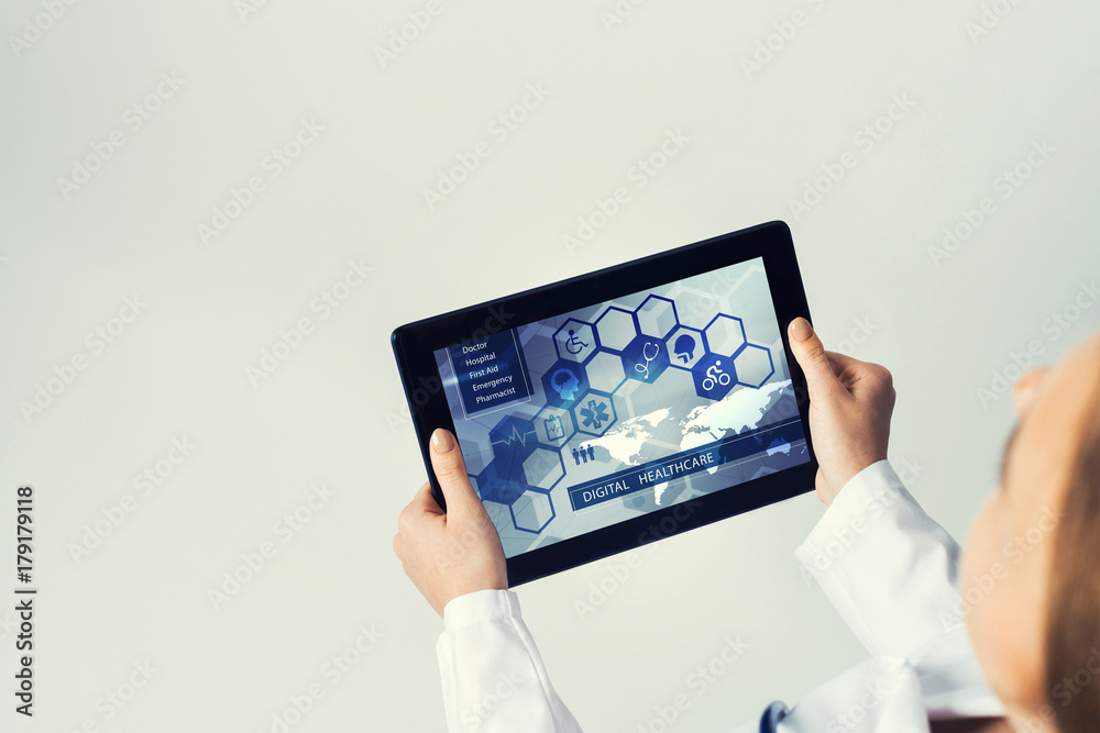 Close of female doctor hands working with tablet pc computer