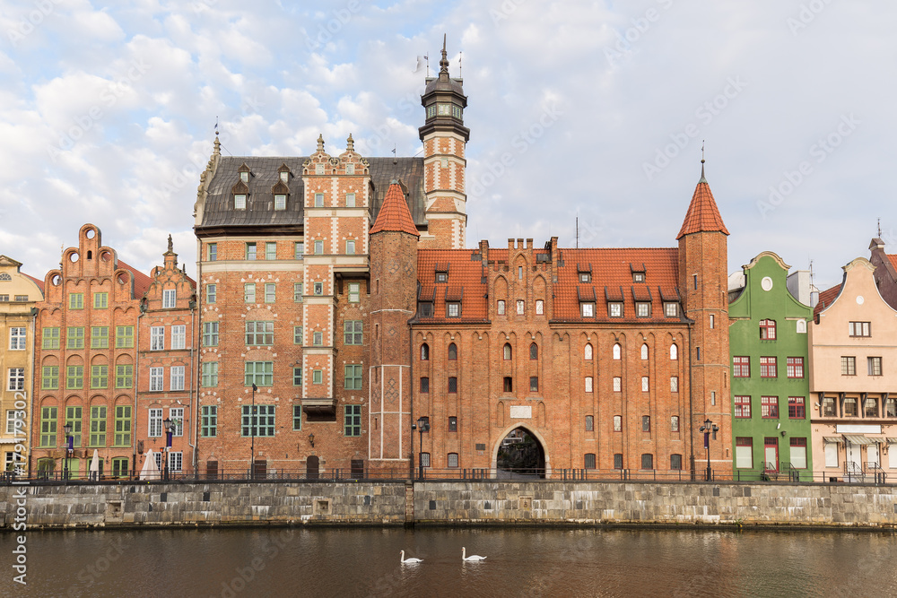 View of old buildings along the Long Bridge waterfront at the Main Town in Gdansk, Poland, in the daytime.
