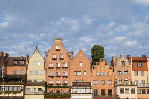 View of old buildings along the Long Bridge waterfront at the Main Town in Gdansk, Poland, in the daytime. Copy space.