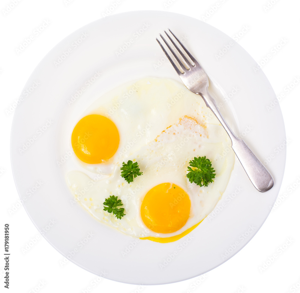 Fried eggs on white plate for breakfast Fried eggs on white plate for breakfast