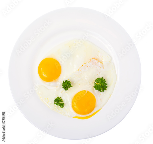 Fried eggs on white plate for breakfast