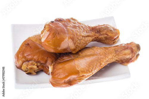 Smoked chicken pieces on white background