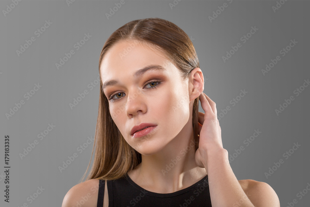 portrait of Beautiful woman corrects hair portrait of Beautiful woman corrects hair