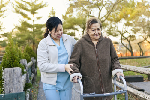 Homecare Nurse Helps Senior Citizen Patient Exercise photo