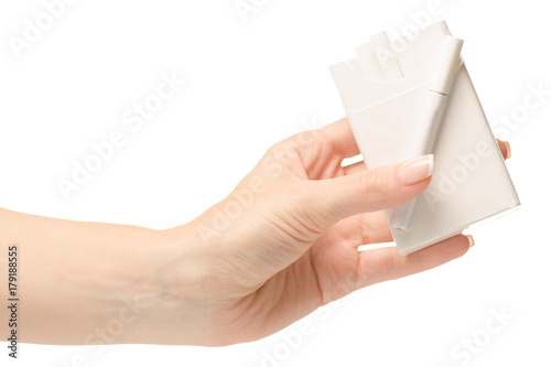 Female hand holding a pack of cigarettes