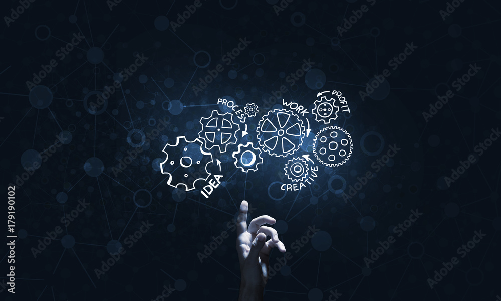 Glowing cogwheel mechanism icon on dark background as symbol of teamwork Glowing cogwheel mechanism icon on dark background as symbol of teamwork