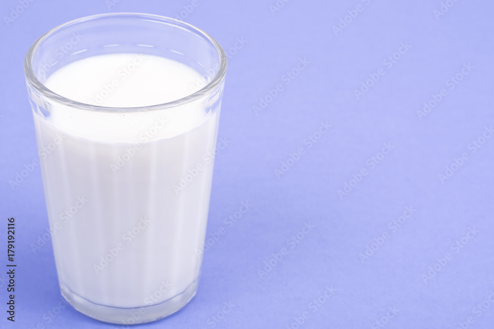 Glass with milk on bright background Glass with milk on bright background
