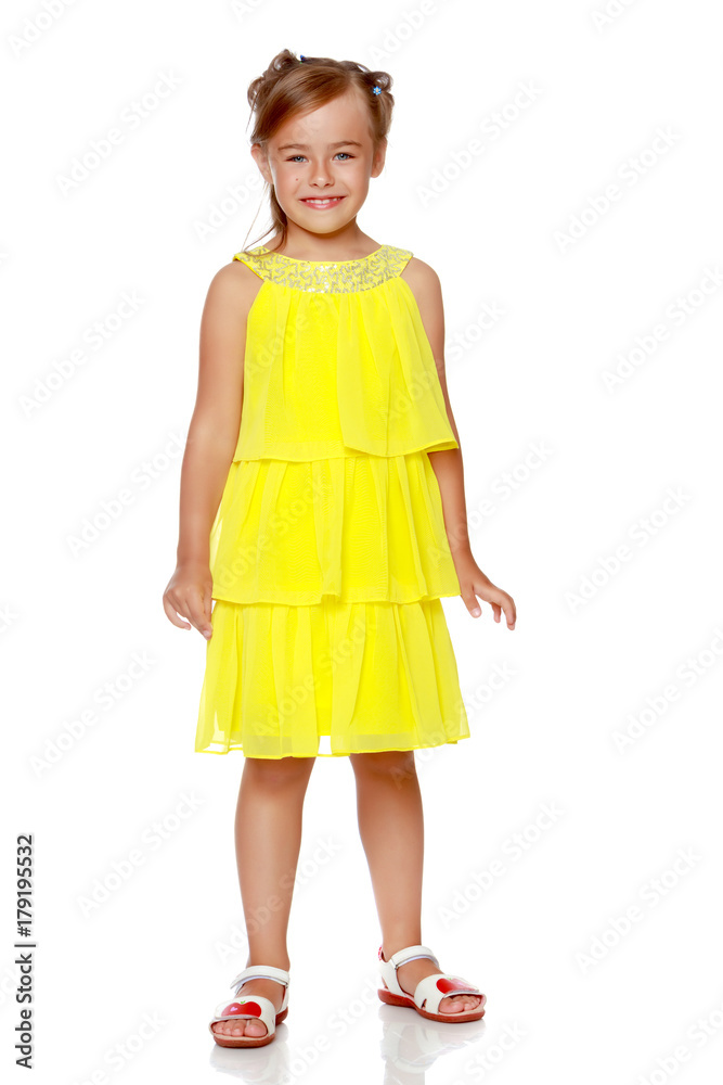 Fashionable little girl in a dress